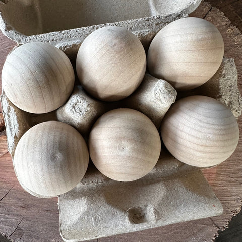 Wooden Eggs in Cardboard Egg Carton